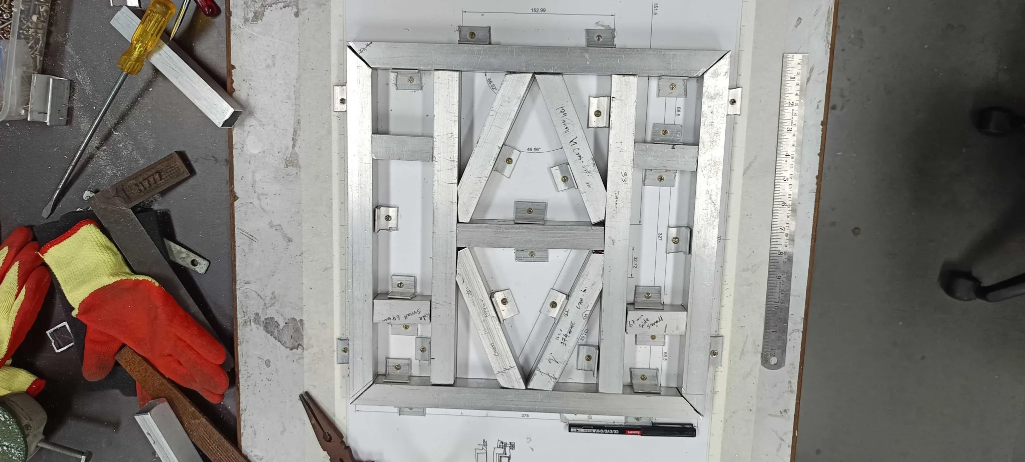 Chassis frame laid out on the welding jig
